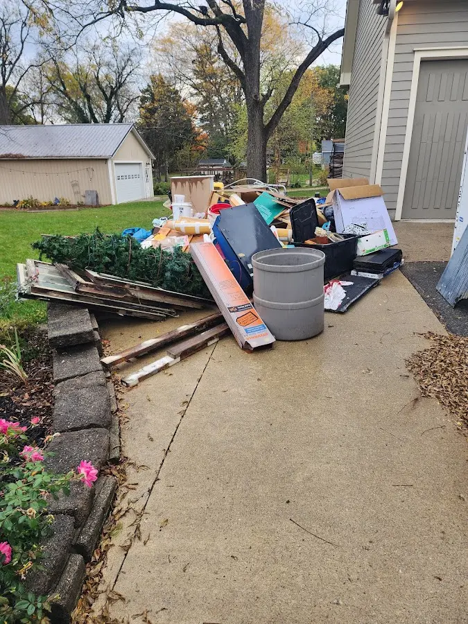 Dumpster being loaded with debris for 30 Yard Dumpster Rental in Columbia